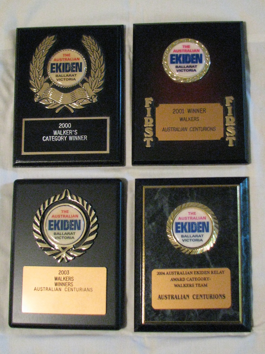 Our 4 winning plaques from the Ballarat Ekiden Relay
For a number of years, the Australian Centurions entered a team in the Ballarat Ekiden Relay which was contested around Lake Wendouree in Ballarat. We were lucky enough to win the walk division on 4 occasions - 2000, 2001, 2003 and 2004 - and these winners' plaques were awarded to us. 

